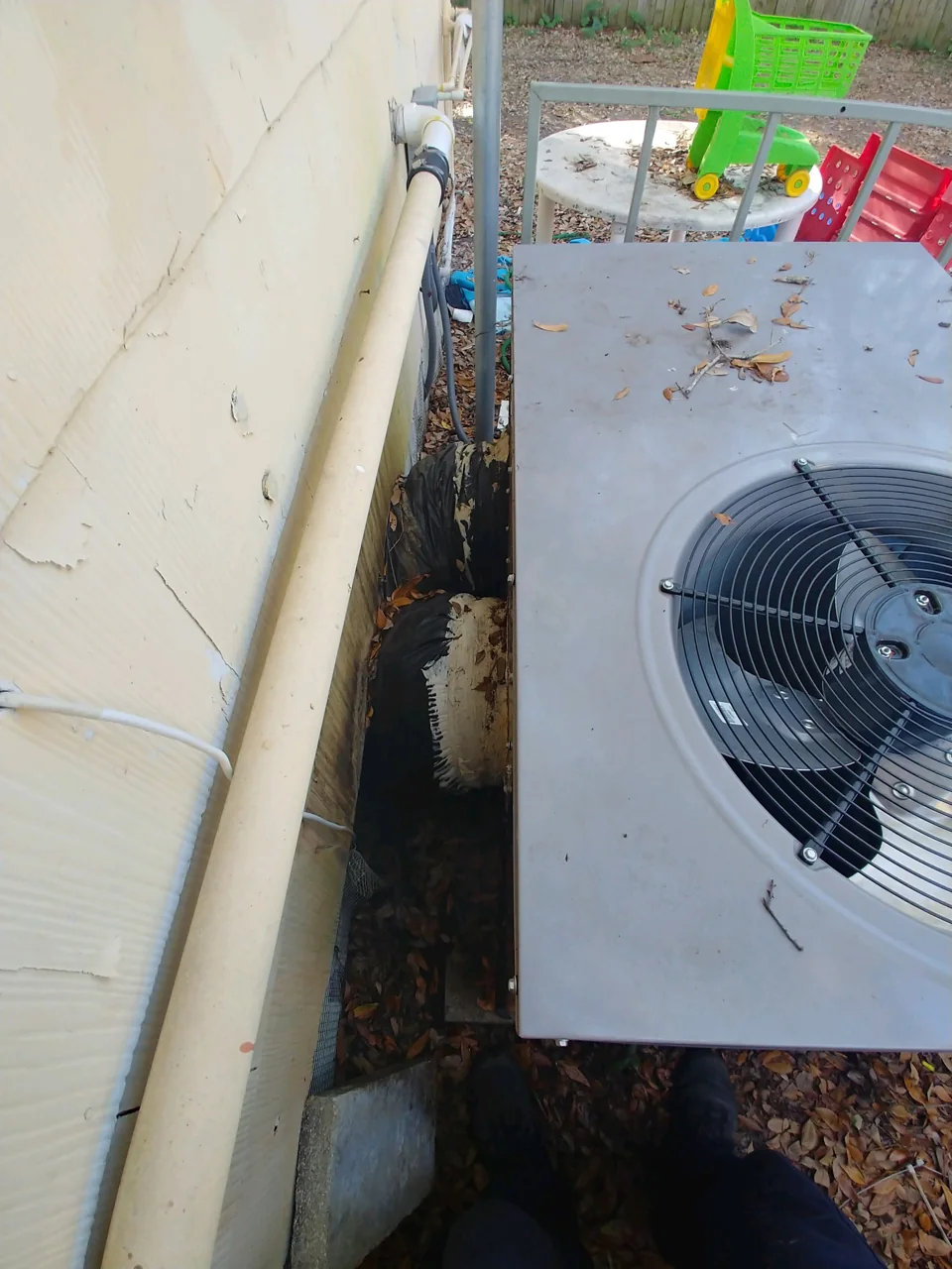 Outdoor air conditioning equipment beside a home