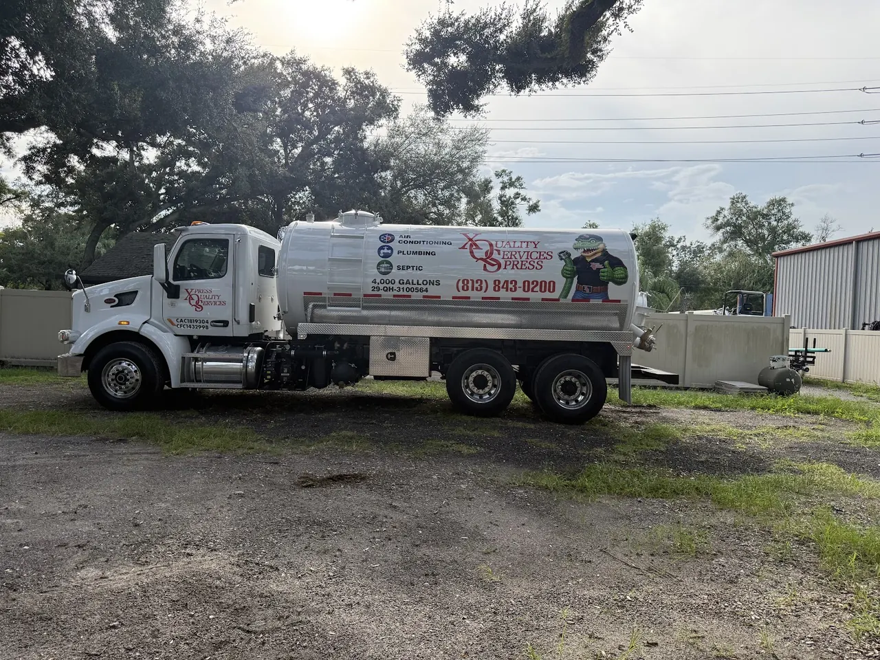 XQS septic pump truck at a job site.