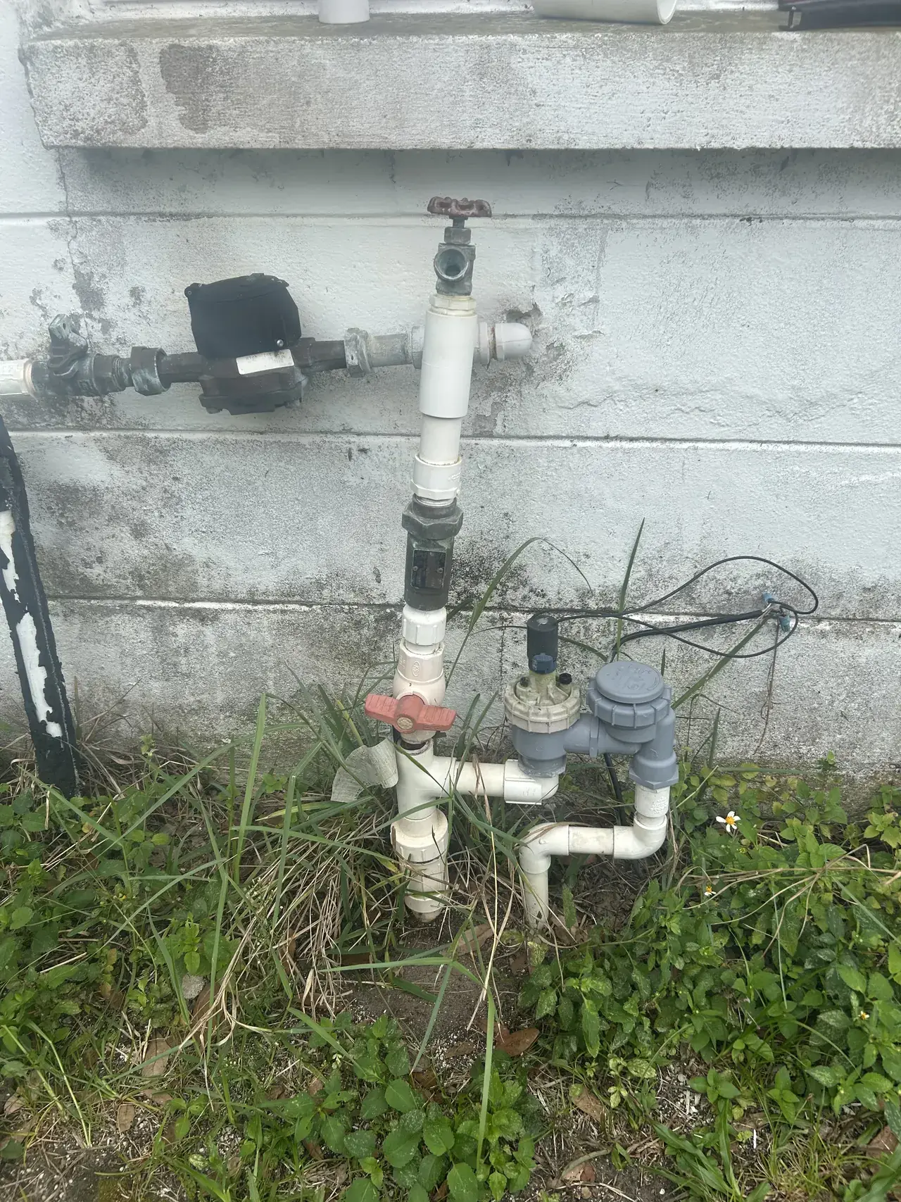 Exterior piping condition documented before leak repair in Holiday.