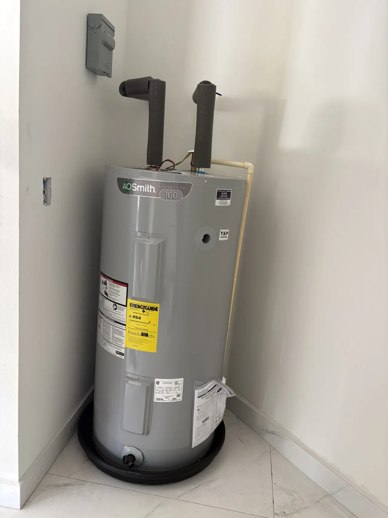 Water heater and insulated connections documented during a plumbing job in Lutz.
