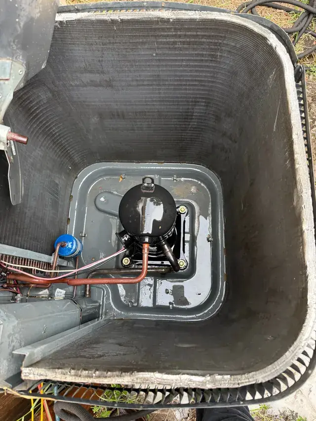 Interior of an outdoor AC unit documented during service work in Port Richey.
