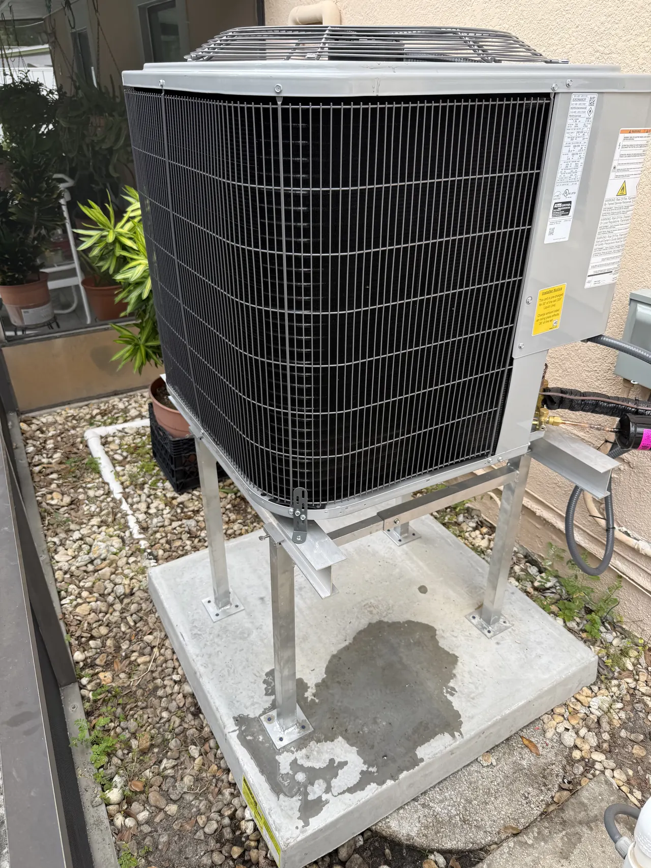 Outdoor AC unit documented during an XQS installation in Tampa.