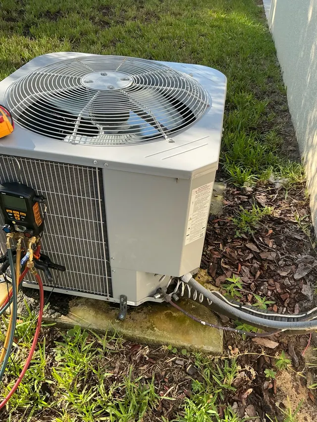 Outdoor AC unit and service connections documented during an HVAC visit in Tarpon Springs.