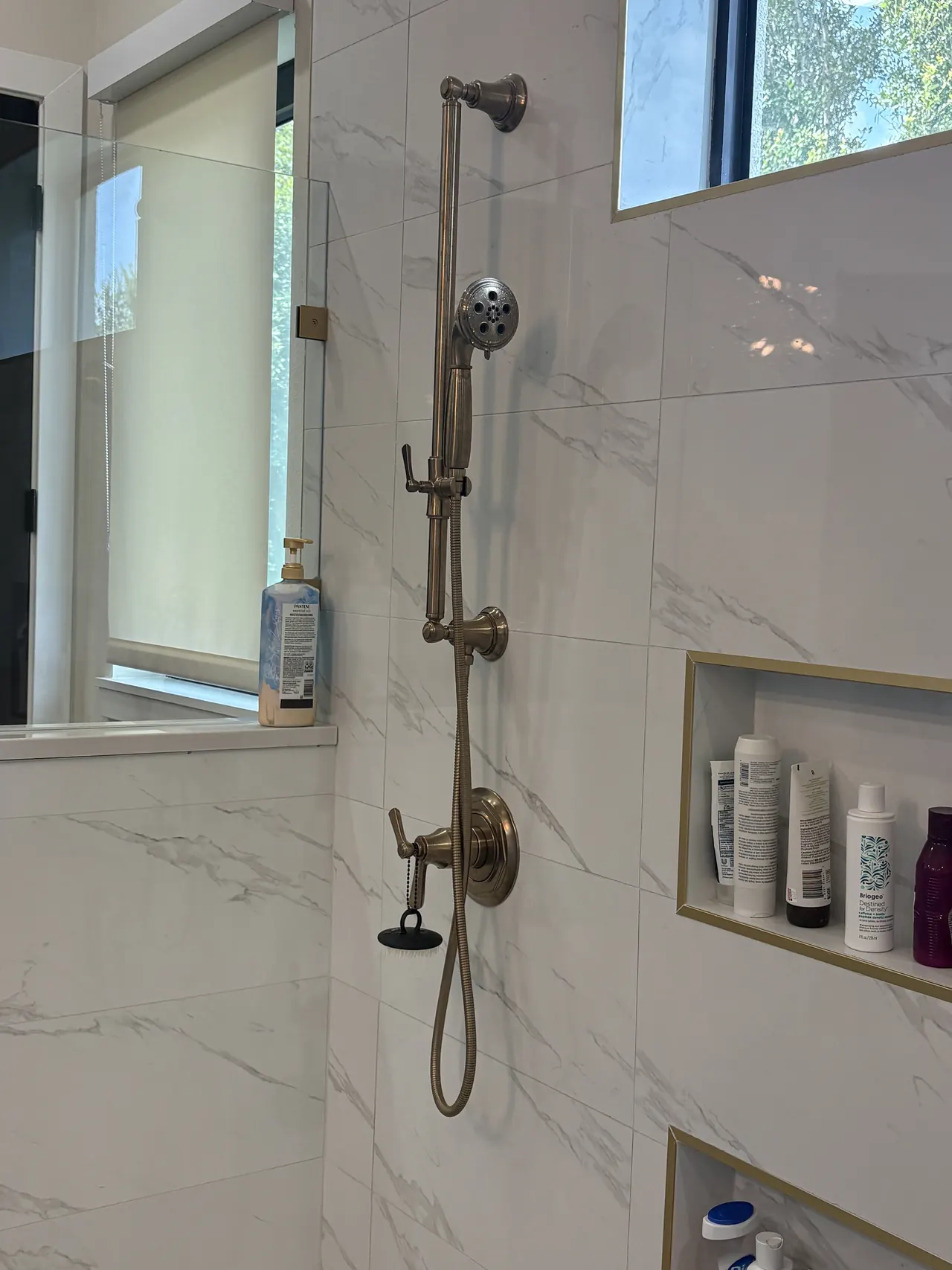 Shower fixtures documented during an XQS plumbing service in Wesley Chapel.