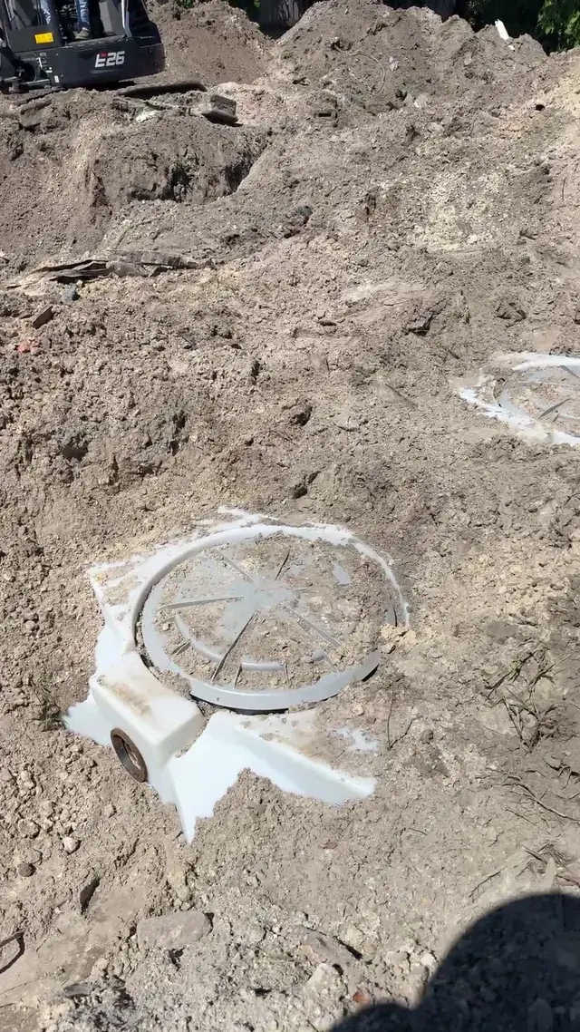 Septic tank access lid exposed in the soil, XQS job video